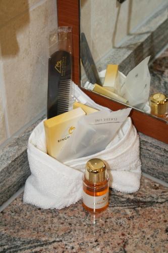 a bathroom counter with a towel and a hair brush at Ringhotel Teutoburger Wald in Tecklenburg
