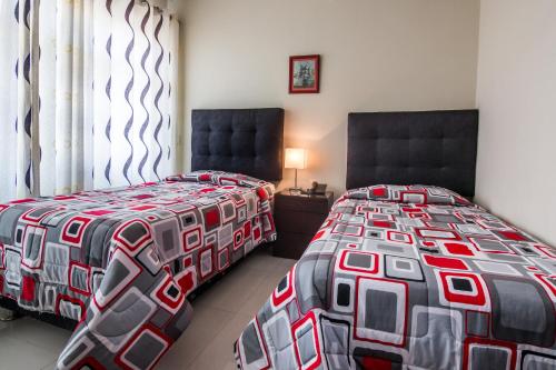 Postel nebo postele na pokoji v ubytování Hotel El Sol