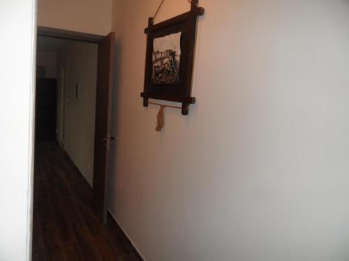a hallway with a wall with a picture on it at SUNSHINE APTS, TWO BEDROOM , FREE INTERNET, No 3 in Ayia Napa