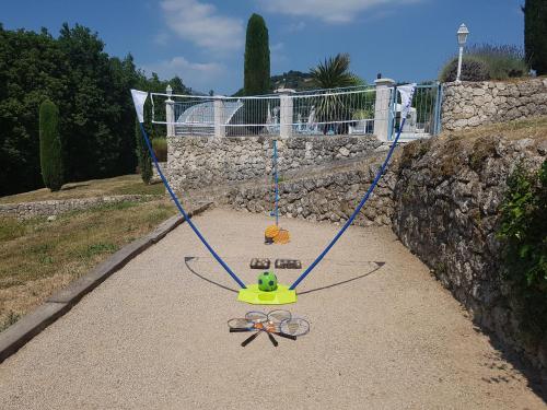 a swing with a bunch of scissors on it at B&B with charm, quiet, kitchen, sw pool. in Grasse