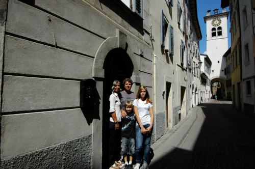 a family standing in the doorway of a building at BeB Casa Bettini in Rovereto