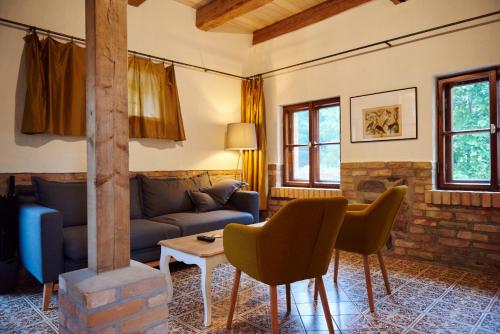 a living room with a couch and a table at Mühle Tornow am Wentowsee in Tornow