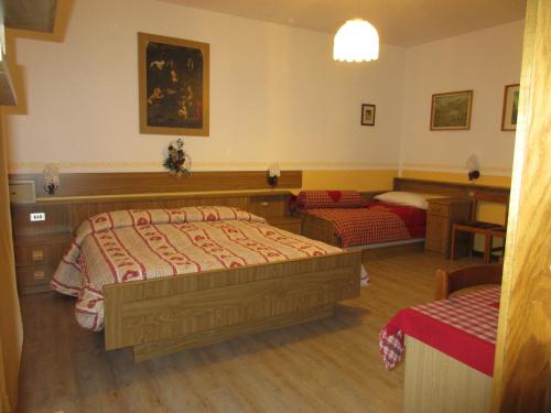 En eller flere senger på et rom på Garnì Defrancesco