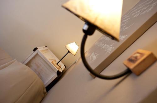Postel nebo postele na pokoji v ubytování Hotel Cernia Isola Botanica