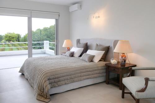 A bed or beds in a room at Vineyard Estate