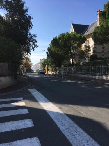 a street with a crosswalk in the middle of the road at Studio Plage Royan in Royan