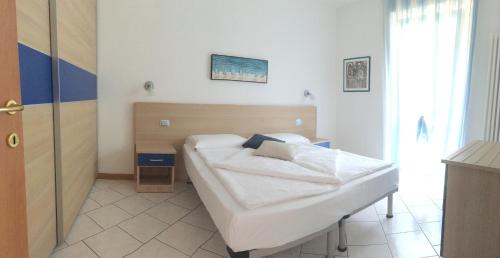 a bedroom with a bed in a room at Mary Apartments in Brenzone sul Garda