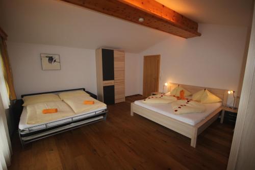 Ein Bett oder Betten in einem Zimmer der Unterkunft AlpenAppartement