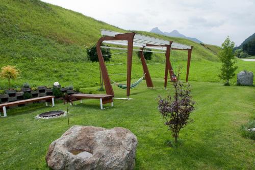 a park with a playground and a swing at Ferienwohnung Robi in Fulpmes