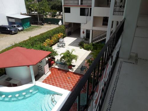 an aerial view of a building with a swimming pool at Balcon Gueela in Santa Cruz Huatulco