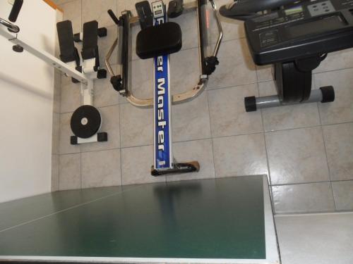 a table in a gym with a sign on the wall at Holiday Home Villa Venta in Trogir