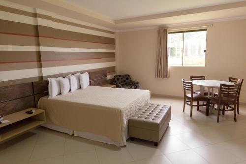 Krevet ili kreveti u jedinici u objektu Vale dos Carajás Hotel