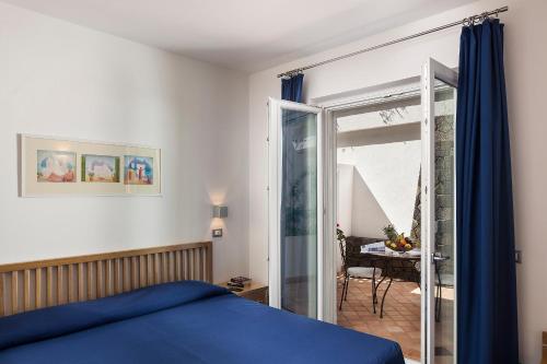 Postel nebo postele na pokoji v ubytování Grifo Hotel Charme & SPA