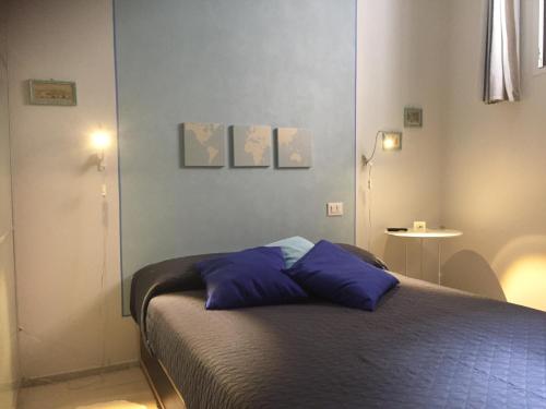 A bed or beds in a room at Casa Pervinca