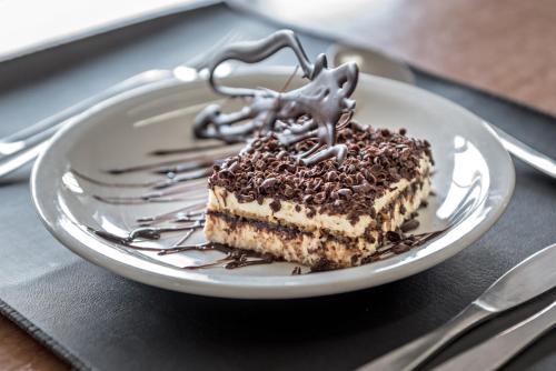 a piece of cake on a plate on a tray at Hotel Riviera in Mar del Plata