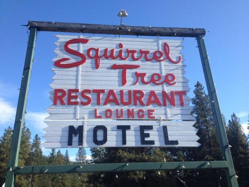 a sign for a restaurant lounging motel at Squirrel Tree Resort in Leavenworth