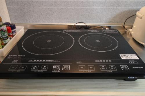 a cd player sitting on top of a table at Nagomiya Kyoto Minami-Enmachi in Kyoto