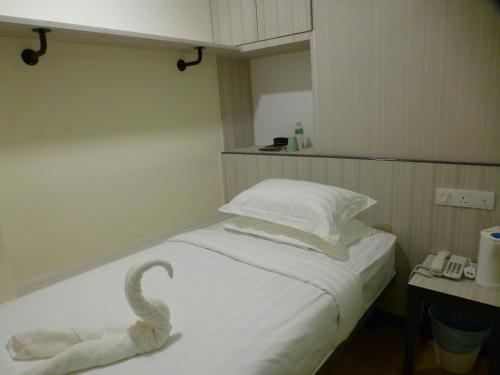 Кровать или кровати в номере Hotel 138 @ Bestari