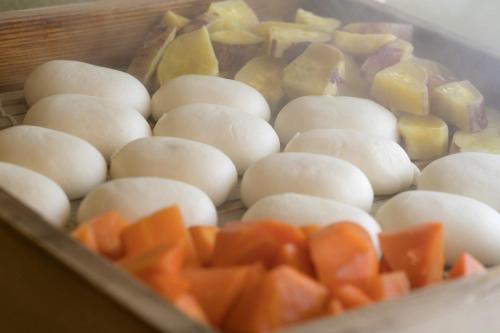 a tray filled with eggs and vegetables on a table at Hotel Forza Nagasaki in Nagasaki