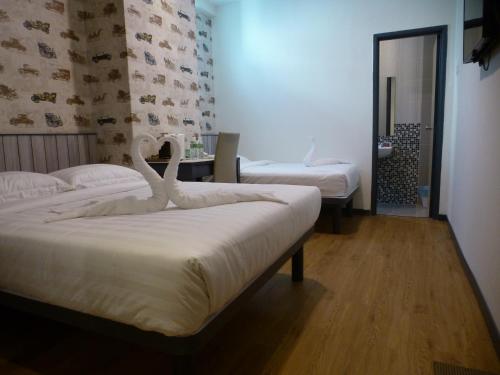 Кровать или кровати в номере Hotel 138 @ Bestari