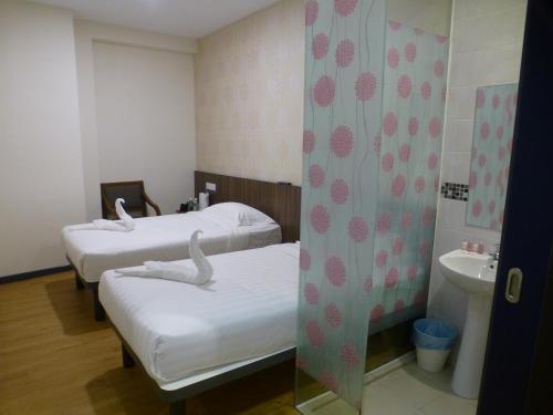 Кровать или кровати в номере Hotel 138 @ Bestari