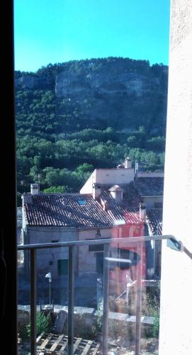 a view of a city from a window of a building at El Pretil del Olmo in Cuenca