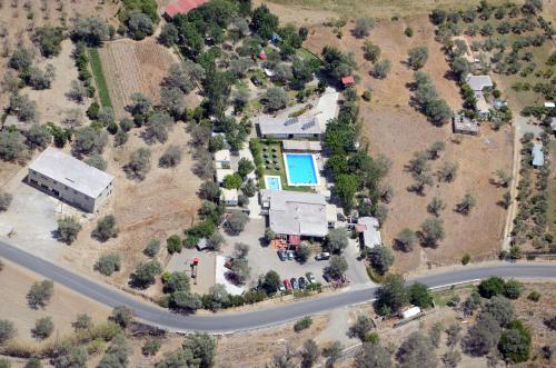 an aerial view of a house and a road at Camping Orgiva in Órgiva