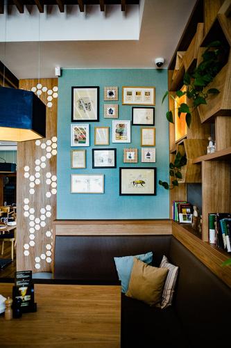 a room with a blue wall with pictures on it at Bulwary Biznes in Mielec