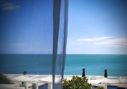 a view of the ocean from a hotel window at La Casa E Il Mare, Private Bay Hotel in Mattinata