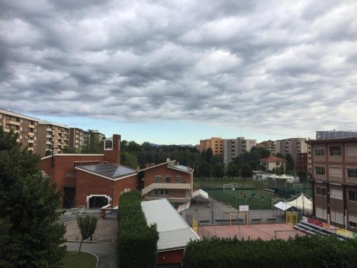 a cloudy sky over a city with buildings at A casa mia in Saronno