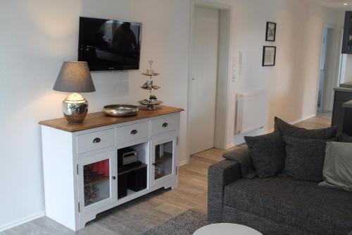 TV a/nebo společenská místnost v ubytování Appartement Geestblick