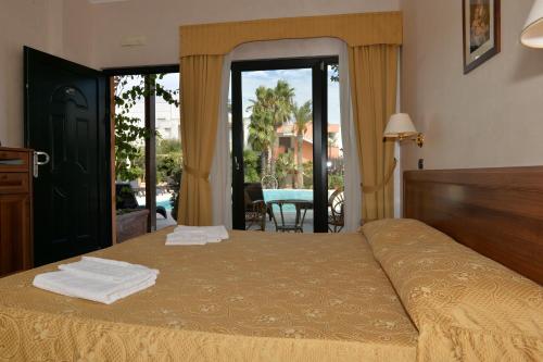 En eller flere senger på et rom på Hotel Cuor Di Puglia