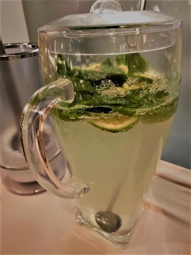 a glass blender filled with green liquid on a table at Victoriya's House in Hisarya