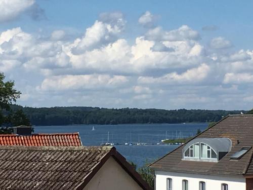 a view of a lake from the roofs of houses at Wittlers Hotel in Ratzeburg