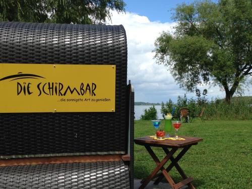 a sign for a table with two glasses on it at Wittlers Hotel in Ratzeburg