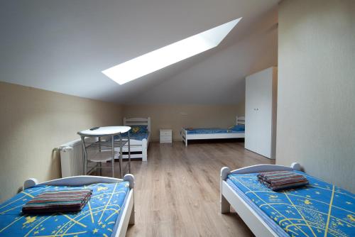 Postel nebo postele na pokoji v ubytování Happy Hotel