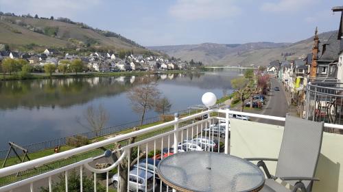 a balcony with a view of a river at Haus Brandenburg an der Mosel in Zell an der Mosel