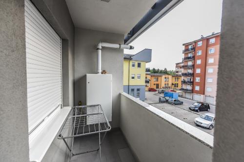 a basket on the balcony of a building at Yasmin Apartment (Pozega in Serbia) in Požega