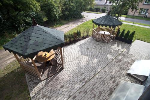 an aerial view of a bird cage and a gazebo at Happy Hotel in Rīga