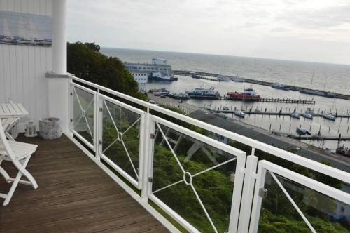 a balcony with a view of a marina at Villa Prinz Heinrich _ Panoramabli in Sassnitz