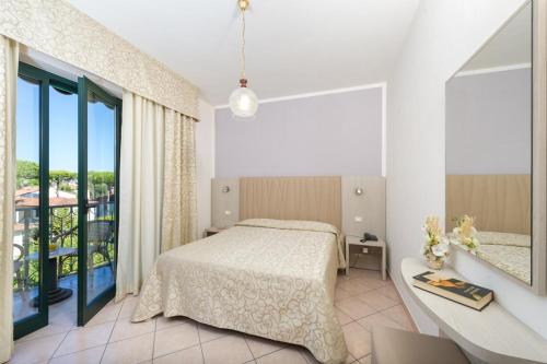 Letto o letti in una camera di Hotel Dei Tigli