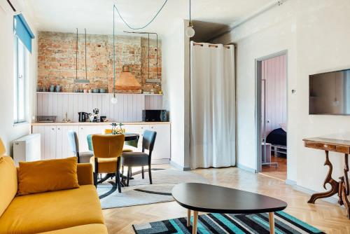 a living room with a couch and a table at Cluj Apartments in Cluj-Napoca