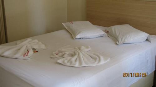 Postel nebo postele na pokoji v ubytování Hotel Joia