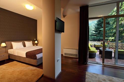 A bed or beds in a room at Hotel Šator