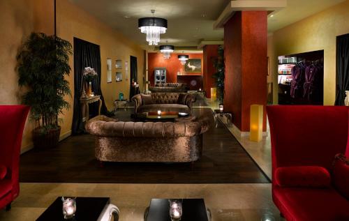 a living room with two couches and a table at Royal Maxim Palace Kempinski Cairo in Cairo