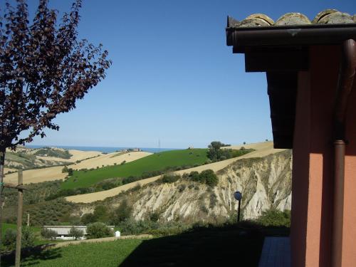 a view of a mountain from a house at Agriturismo Il Borgo Degli Ulivi in Roseto degli Abruzzi