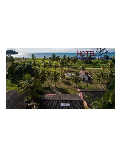a view of the beach from the balcony of a hotel at Hotel Palmas del Pacifico in Nuquí