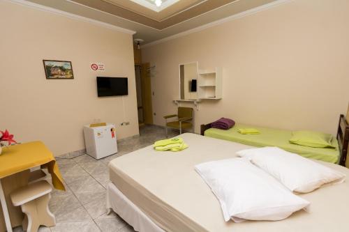 Katil atau katil-katil dalam bilik di Pousada Portal