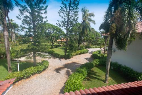 an aerial view of a garden with palm trees at El Pelicano Apart-Hotel in Las Galeras