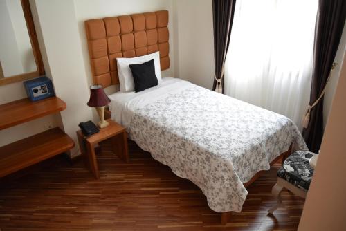 Postel nebo postele na pokoji v ubytování Casa Joaquin Boutique Hotel